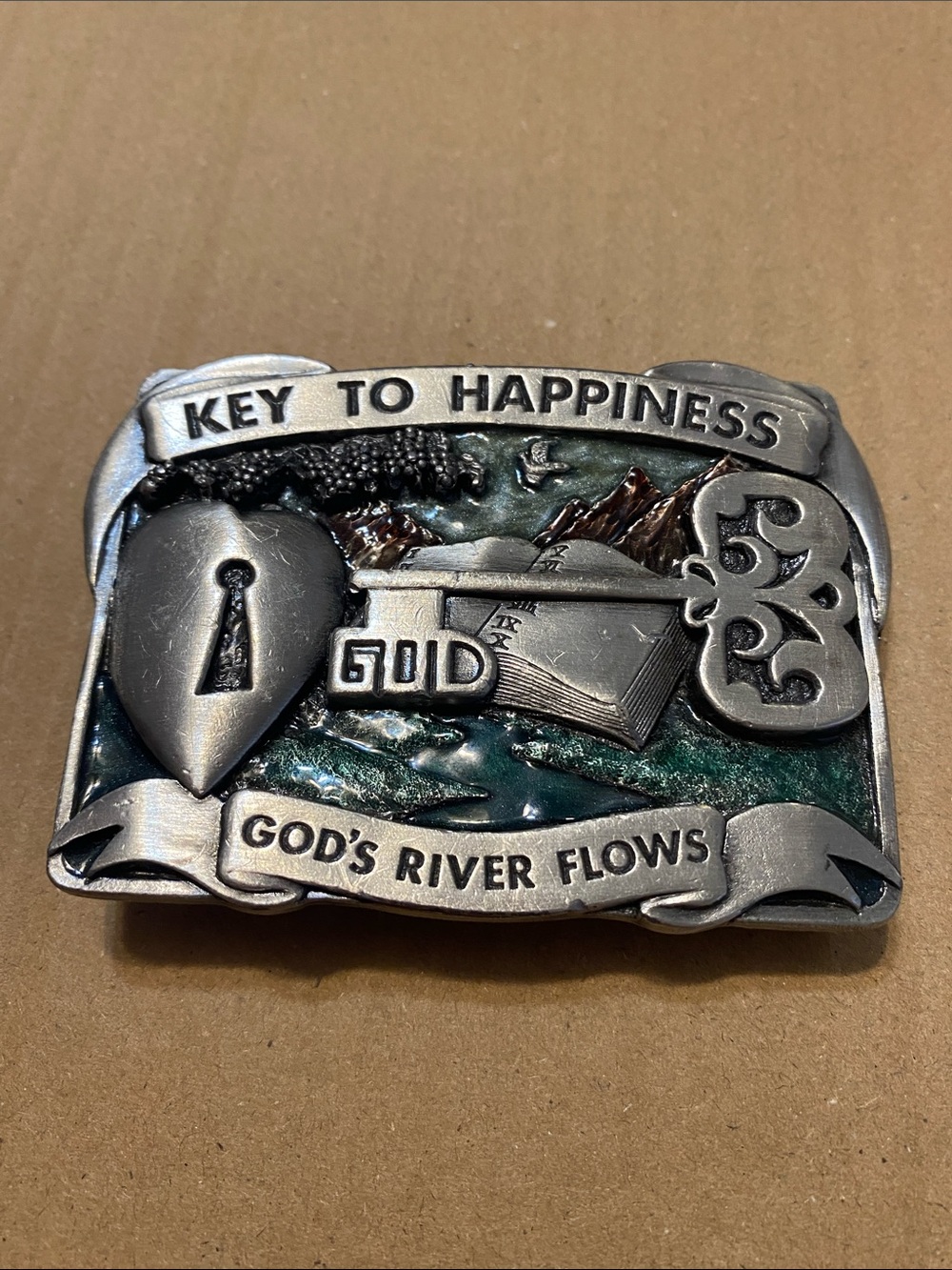 I take 1984 Bergamont Brass Works “Key to Happiness “  Silver Belt Buckle